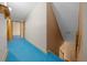 Hallway with blue flooring leading to staircase at 4301 Se 38Th St, Ocala, FL 34480