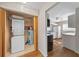 Laundry and kitchen view with stackable washer/dryer at 4301 Se 38Th St, Ocala, FL 34480