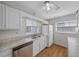 Kitchen with white cabinets, vinyl flooring, and appliances at 4301 Se 38Th St, Ocala, FL 34480