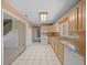 Kitchen with wood cabinets, granite countertops, and white appliances at 4301 Se 38Th St, Ocala, FL 34480