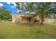 Tan metal workshop with covered patio area at 4301 Se 38Th St, Ocala, FL 34480