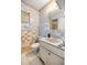 Checkerboard tiled bathroom with vanity and toilet at 438 Spring Ln, Ocala, FL 34472
