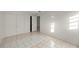 Small bedroom with tile floors and double doors at 438 Spring Ln, Ocala, FL 34472