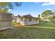 Back of house with shed and spacious yard at 438 Spring Ln, Ocala, FL 34472