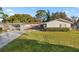 Ranch style home with carport and mature landscaping at 438 Spring Ln, Ocala, FL 34472