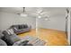 Bright living room featuring hardwood floors and a ceiling fan at 438 Spring Ln, Ocala, FL 34472
