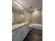 Bathroom featuring granite counters, white cabinets, and tiled tub/shower at 6414 Sw 67Th Pl, Ocala, FL 34476