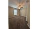 Bedroom with neutral walls, plush carpet, ceiling fan, and a window at 6414 Sw 67Th Pl, Ocala, FL 34476