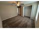 Cozy bedroom featuring neutral walls, plush carpet, ceiling fan, and a closet at 6414 Sw 67Th Pl, Ocala, FL 34476