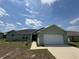 Charming single-story home with a two-car garage and manicured lawn at 6414 Sw 67Th Pl, Ocala, FL 34476