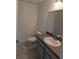 Clean bathroom with gray vanity and tile flooring at 67 Nw Sparrow Rd, Dunnellon, FL 34431