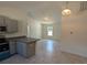 Modern kitchen with grey cabinets and stainless steel appliances at 67 Nw Sparrow Rd, Dunnellon, FL 34431