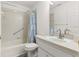 Bathroom features shower over tub, vanity and toilet at 9014 Sw 96Th Ter, Ocala, FL 34481