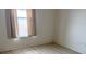 Bedroom with wood-look flooring and a window at 9014 Sw 96Th Ter, Ocala, FL 34481