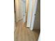 Hallway with clean, light-colored flooring and white trim at 9014 Sw 96Th Ter, Ocala, FL 34481