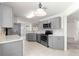 Modern kitchen with gray cabinets, stainless steel appliances, and stylish backsplash at 9014 Sw 96Th Ter, Ocala, FL 34481