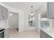 Cozy kitchen nook with large windows and gray cabinetry, perfect for casual dining at 9014 Sw 96Th Ter, Ocala, FL 34481