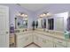 Bright bathroom featuring double sinks, large mirrors, and ample counter space at 9708 Sw 97Th St, Ocala, FL 34481
