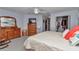 Comfortable bedroom with a ceiling fan, closet, and a serene atmosphere at 9708 Sw 97Th St, Ocala, FL 34481