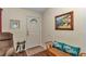 Inviting entryway with a white door, and a painting, offering a cozy and welcoming atmosphere at 9708 Sw 97Th St, Ocala, FL 34481
