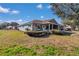 Charming single story home with a cozy front porch, manicured landscaping, and a beautiful lawn at 9708 Sw 97Th St, Ocala, FL 34481