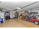 Well-organized garage features epoxy floors, shelves, a workbench, and golf cart storage at 9708 Sw 97Th St, Ocala, FL 34481