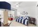 Bright nautical-themed bedroom featuring a desk and a daybed with striped bedding at 12595 Se 97Th Terrace Rd, Summerfield, FL 34491