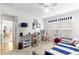 Well-lit bedroom with a nautical theme, a daybed, and a view of the open floor plan at 12595 Se 97Th Terrace Rd, Summerfield, FL 34491