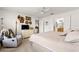 Airy bedroom featuring a ceiling fan, an entertainment center, and a soothing recliner at 12595 Se 97Th Terrace Rd, Summerfield, FL 34491