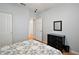 Charming bedroom featuring a black dresser, wood floors, and a soft, inviting quilt at 13100 Se 94Th Ave, Summerfield, FL 34491