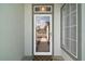 Stylish front door featuring decorative glass and a view of the front yard at 13100 Se 94Th Ave, Summerfield, FL 34491