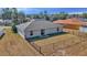 View of the home's fenced backyard showing the grass and patio at 13661 Sw 43Rd Cir, Ocala, FL 34473