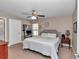 This bedroom features a large window, and a cozy ceiling fan at 13661 Sw 43Rd Cir, Ocala, FL 34473