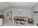 Bright dining room features chandelier lighting and a view to the kitchen at 13661 Sw 43Rd Cir, Ocala, FL 34473