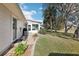 Spacious backyard featuring a brick walkway and an area for outdoor entertaining at 1517 New Abbey Ave, Leesburg, FL 34788