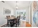 Bright dining room features modern chandelier, wood floors, and neutral decor at 1517 New Abbey Ave, Leesburg, FL 34788