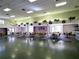 Meeting room featuring tables, chairs, and neutral wall colors with decorative plants at 1517 New Abbey Ave, Leesburg, FL 34788