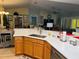 Kitchen with an open floor plan featuring breakfast bar, sink and stainless steel dishwasher at 15842 Sw 11Th Terrace Rd, Ocala, FL 34473