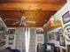 Bedroom with wood-paneled ceiling, window, and decor at 17840 Se 28Th Pl, Silver Springs, FL 34488