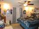 Bright bedroom with ceiling fan and large bed at 17840 Se 28Th Pl, Silver Springs, FL 34488