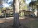 Covered carport with ample parking space and storage at 17840 Se 28Th Pl, Silver Springs, FL 34488