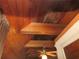 Wood-paneled vaulted ceiling with exposed beams and fan at 17840 Se 28Th Pl, Silver Springs, FL 34488