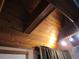 Wood-paneled vaulted ceiling with exposed beams and light fixtures at 17840 Se 28Th Pl, Silver Springs, FL 34488