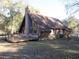 A-frame house with wood siding and large deck at 17840 Se 28Th Pl, Silver Springs, FL 34488