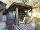 Relaxing gazebo with seating area overlooking the pool at 17840 Se 28Th Pl, Silver Springs, FL 34488