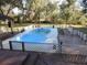 Inground pool with wooden deck and gazebo at 17840 Se 28Th Pl, Silver Springs, FL 34488