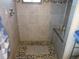 Modern shower with pebble floor and built-in seat at 17840 Se 28Th Pl, Silver Springs, FL 34488