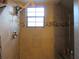 Updated shower with stone accent and window at 17840 Se 28Th Pl, Silver Springs, FL 34488