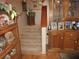 Wooden staircase with decorative features at 17840 Se 28Th Pl, Silver Springs, FL 34488