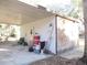 Metal storage shed with a covered carport area at 17840 Se 28Th Pl, Silver Springs, FL 34488